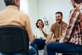 A group of people training for employment in a room.
